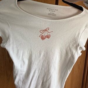 American Eagle Cream Tee with Heart and Bow Design